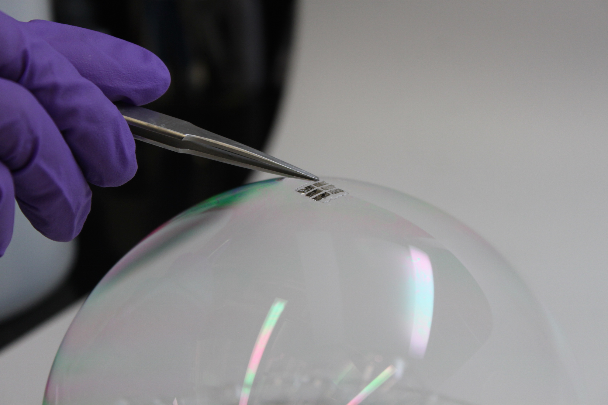 Picture of parylene-based organic solar cell on soap bubble
